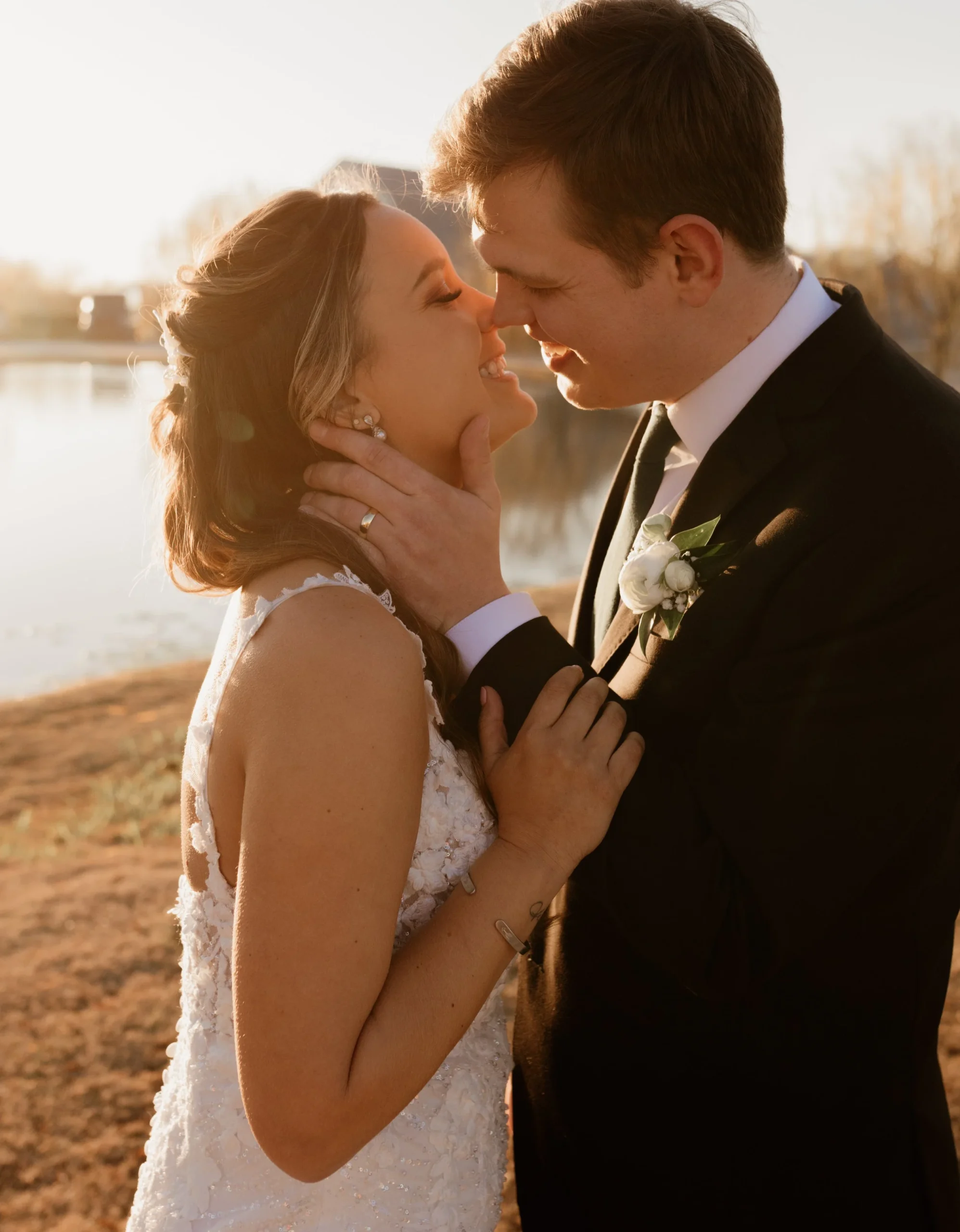 Bride and groom embrace during their golden hour portraits at their Dallas, TX wedding.