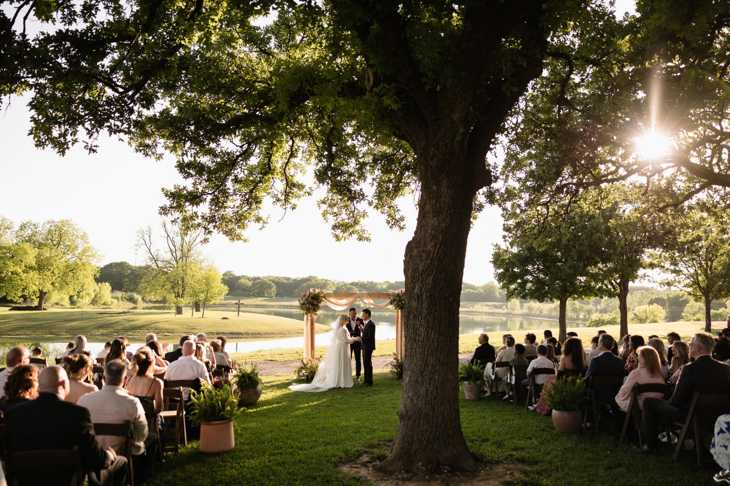 Outdoor wedding ceremony at golden hour